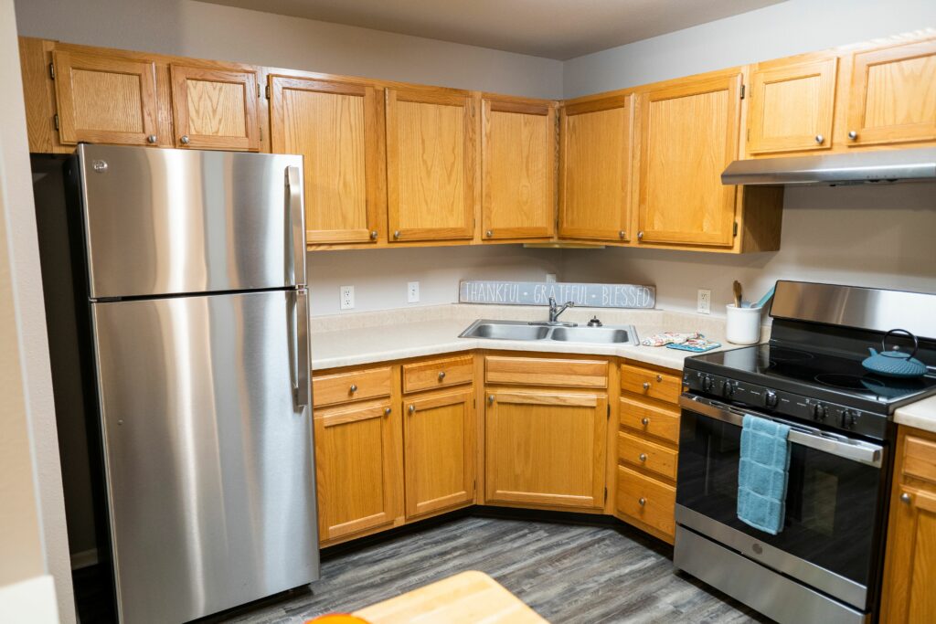 senior apartment kitchen with fridge, oven and sink