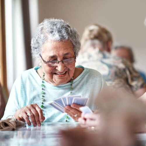 Senior women playing games at their retirement home