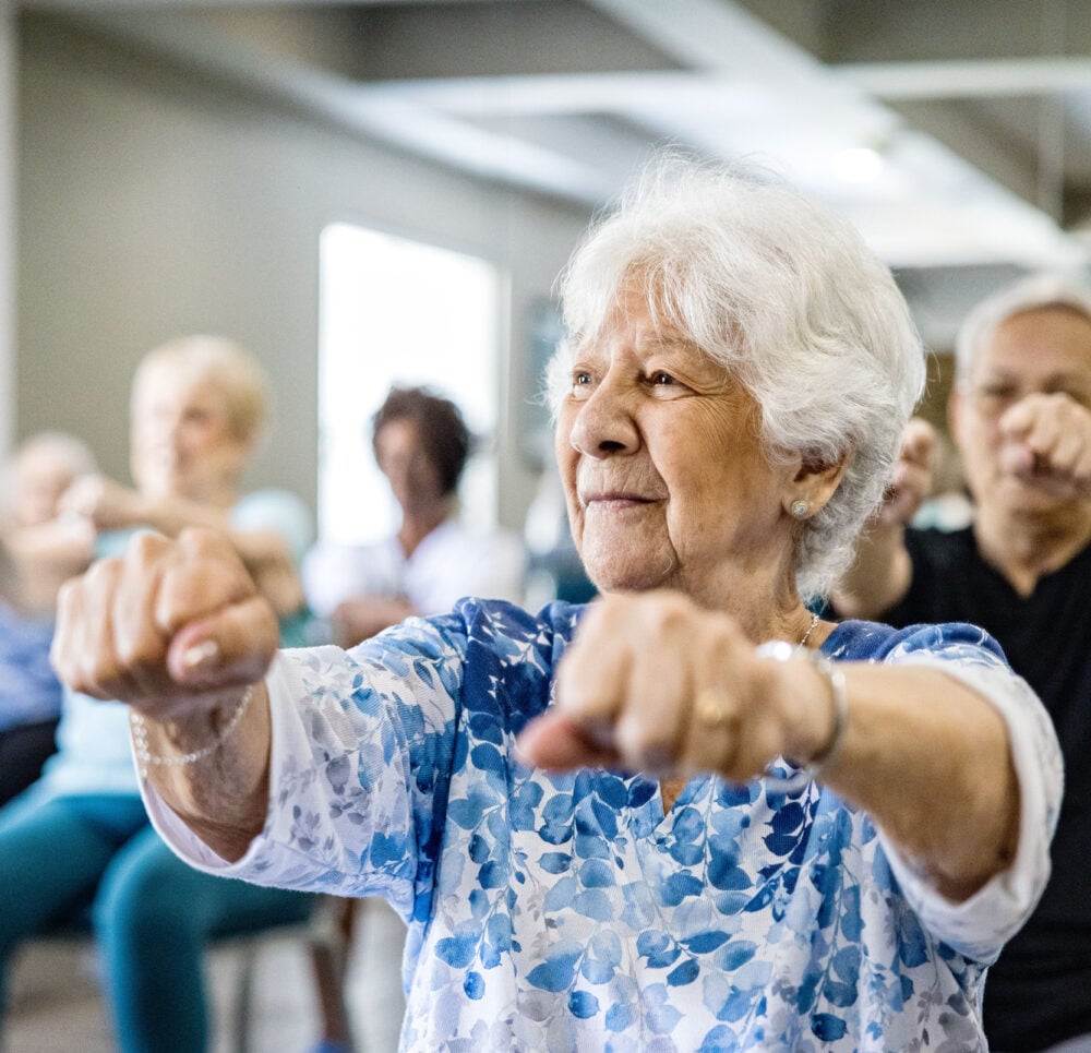 Exercise and wellness programs. Seniors at a community exercising